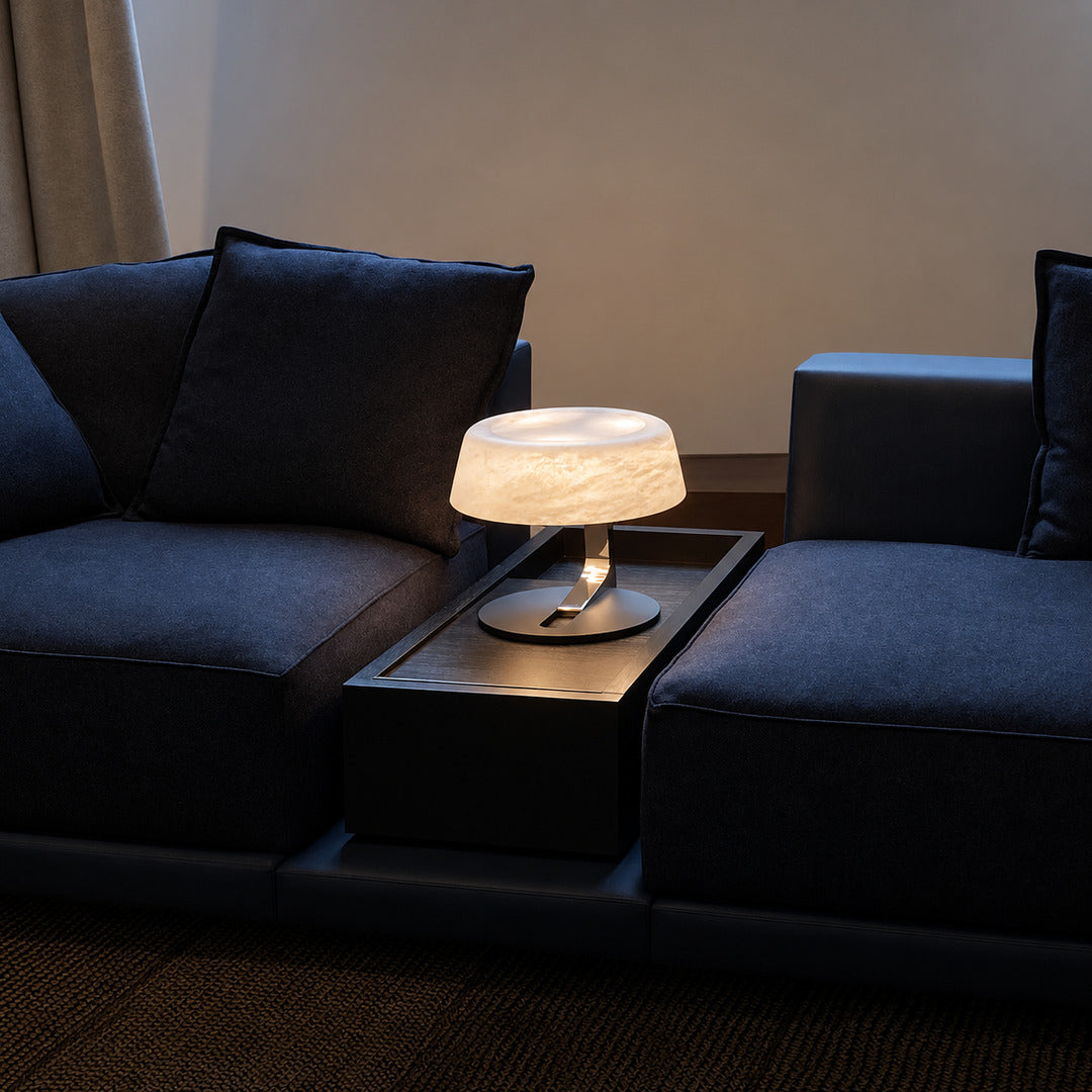 Orbita alabaster table lamp on a side table in a modern living room