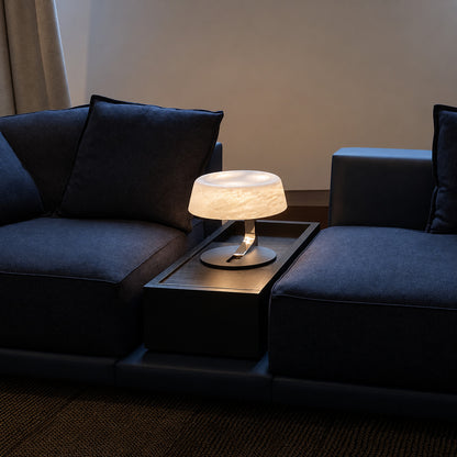 Orbita alabaster table lamp on a side table in a modern living room