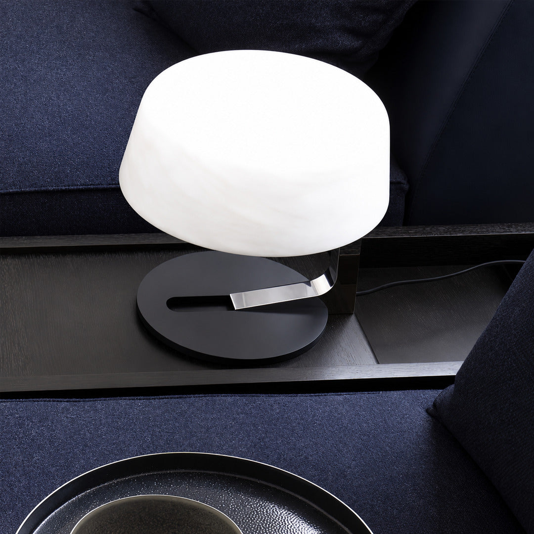 Orbita alabaster table lamp on a side table in a modern living room