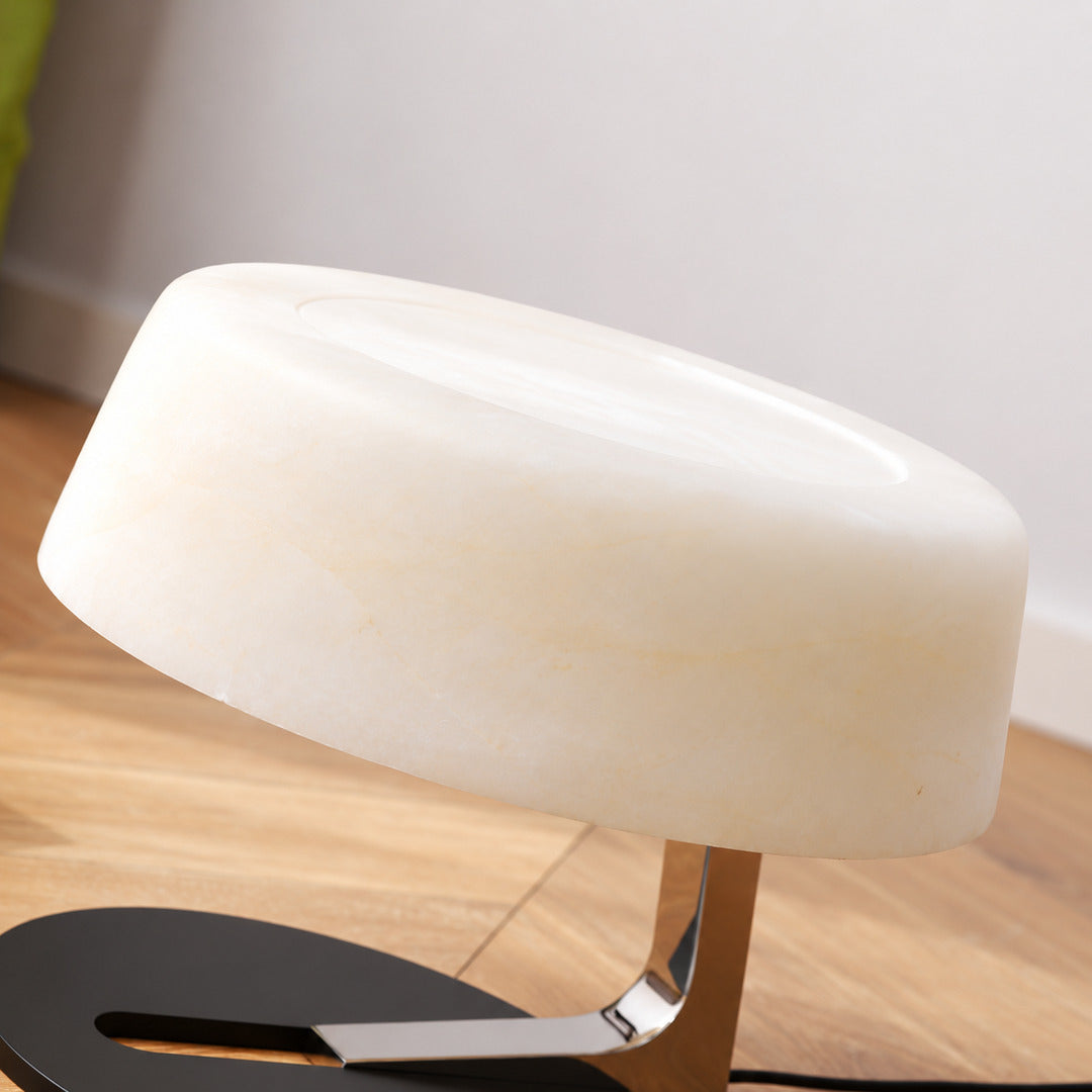Close-up of the milky white alabaster shade of the Orbita lamp unlit