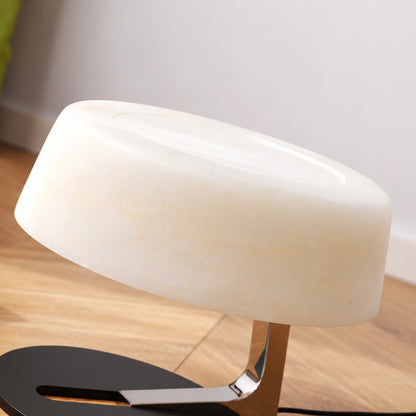 Close-up of the milky white alabaster shade of the Orbita lamp unlit