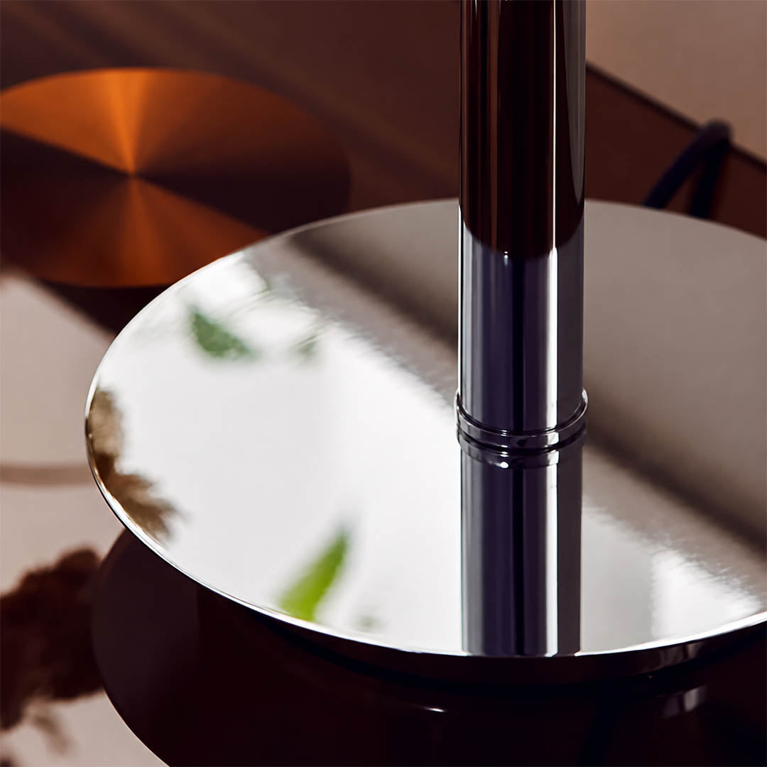 Orbita table lamp illuminated warm orange amber glow through translucent acrylic orb space age cozy intimate evening mood setter detail close up