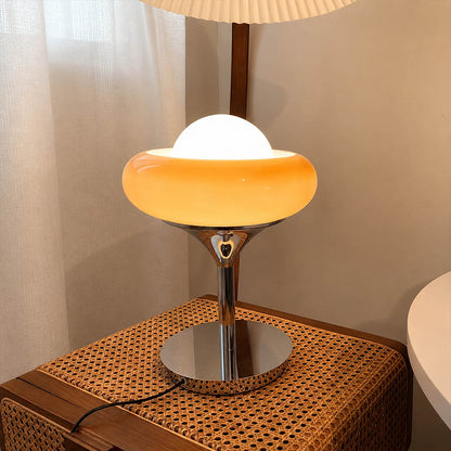 Orbita table lamp modern primary bedroom dressing table vanity chrome orange space age 1970s Italian mid century modern warm ambient morning routine feminine sophisticated lifestyle interior American home
