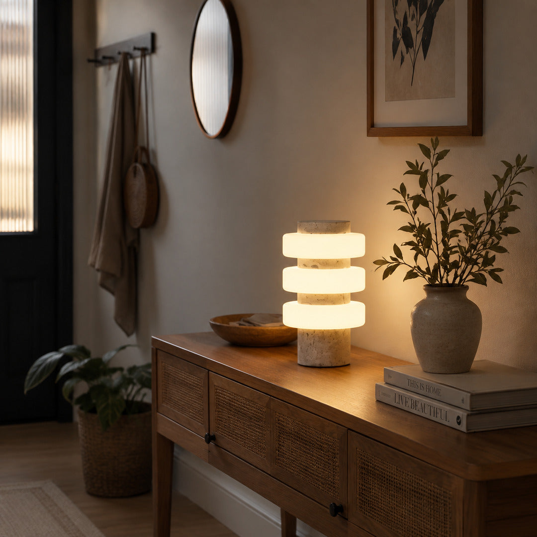 Orbita travertine table lamp entryway console warm glow travertine stone glass rings American home lifestyle interior styled