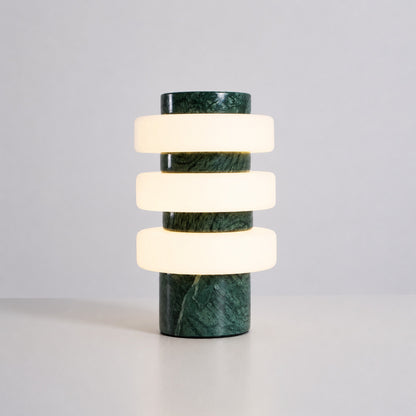 Orbita travertine table lamp green marble stone base glowing glass rings sculptural white background