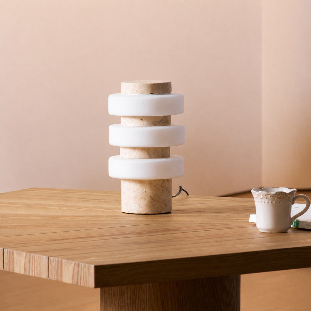 Orbita travertine table lamp study desk warm glow travertine stone glass sculptural American home lifestyle interior styled