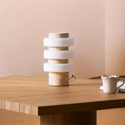 Orbita travertine table lamp study desk warm glow travertine stone glass sculptural American home lifestyle interior styled