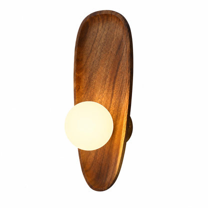 Ovi wood wall lamp illuminated warm soft glow frosted white glass globe walnut wood wabi sabi cozy white background front view