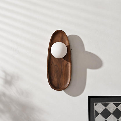 Ovi wood wall lamp walnut pair tv feature accent wall living room frosted glass globe mid century warm American home lifestyle interior