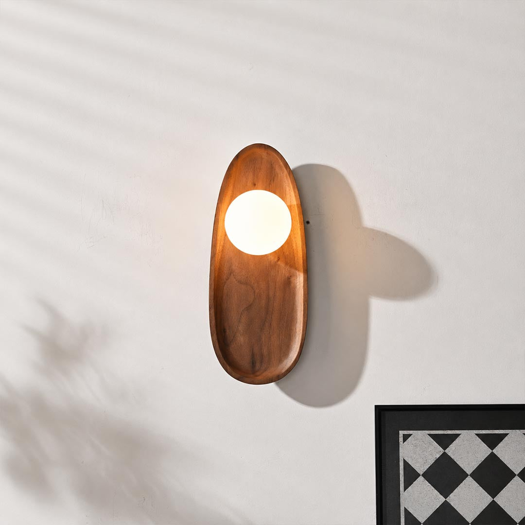 Ovi wood wall lamp walnut pair tv feature accent wall living room frosted glass globe mid century warm American home lifestyle interior