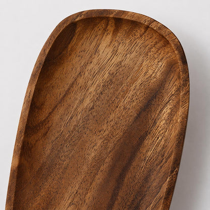 Ovi wood wall lamp solid walnut wood natural grain warm brown sheen handcrafted texture detail close up premium quality