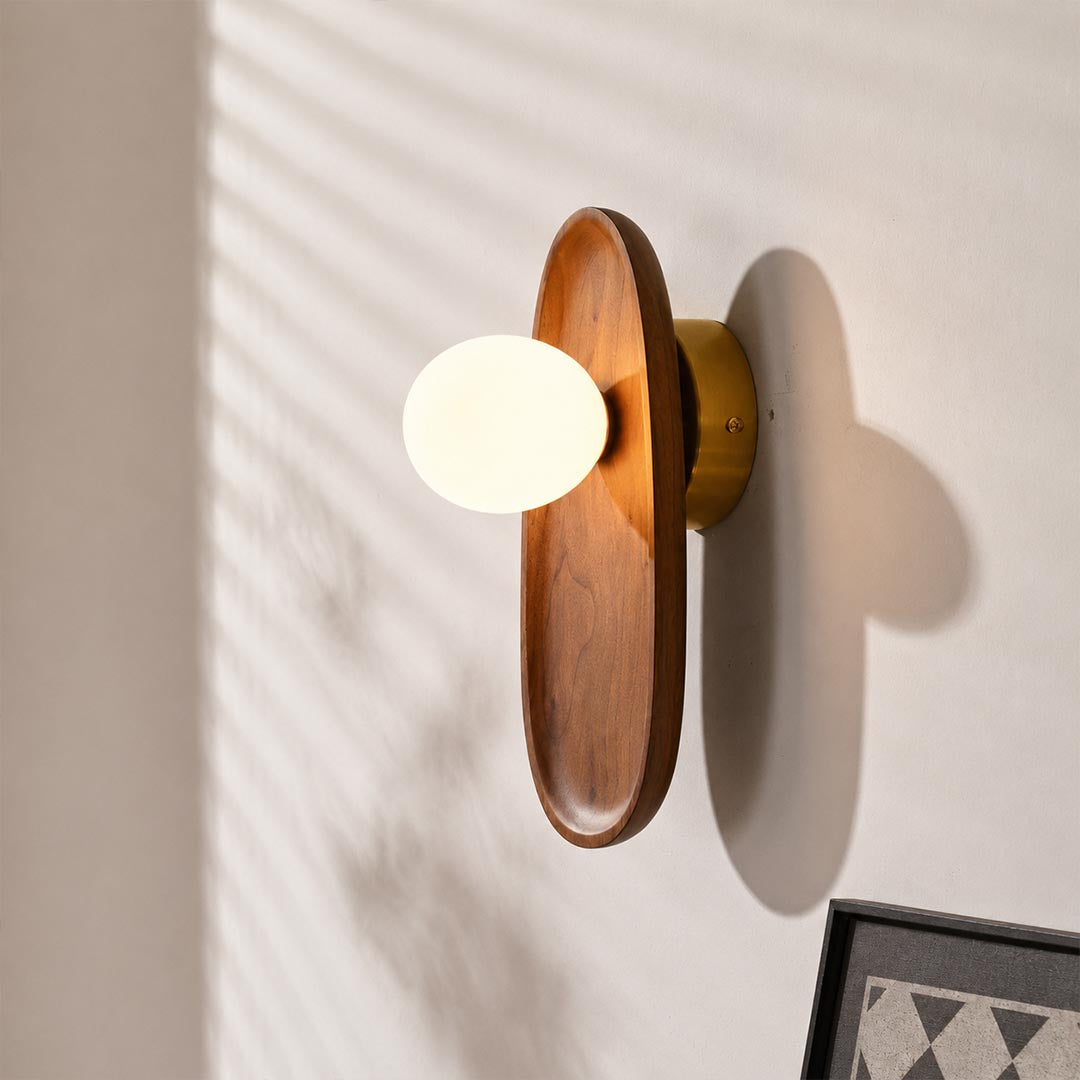 Ovi wood wall lamp walnut pair tv feature accent wall living room frosted glass globe mid century warm American home lifestyle interior