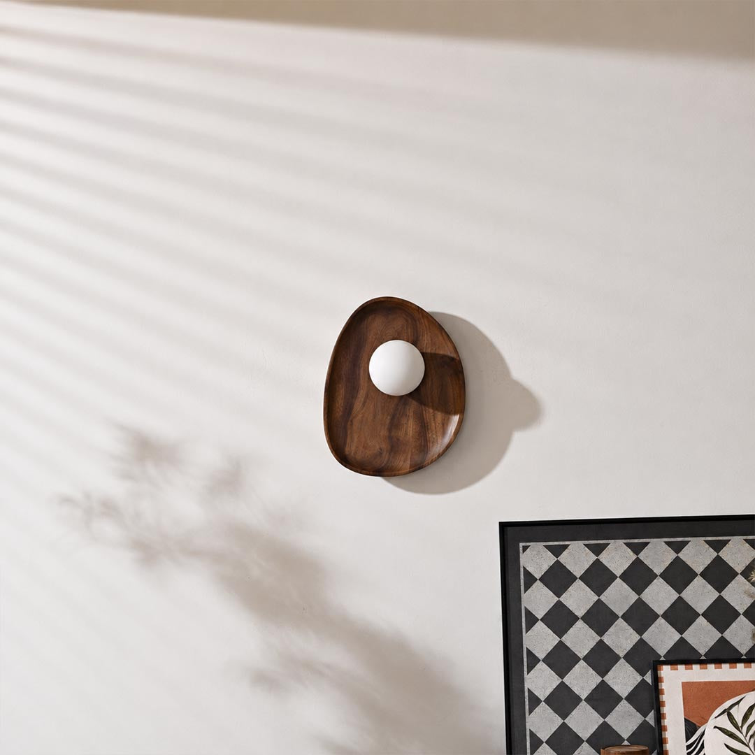 Ovi wood wall lamp walnut pair tv feature accent wall living room frosted glass globe mid century warm American home lifestyle interior