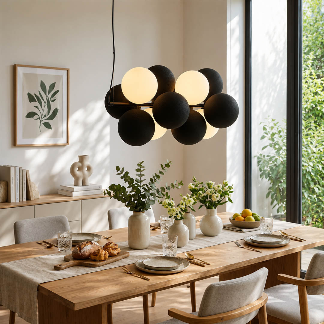 Palina vertical anthracite grey balloon bubble PVC cluster pendant modern dining room walnut table statement retro evening warm ambient lifestyle interior