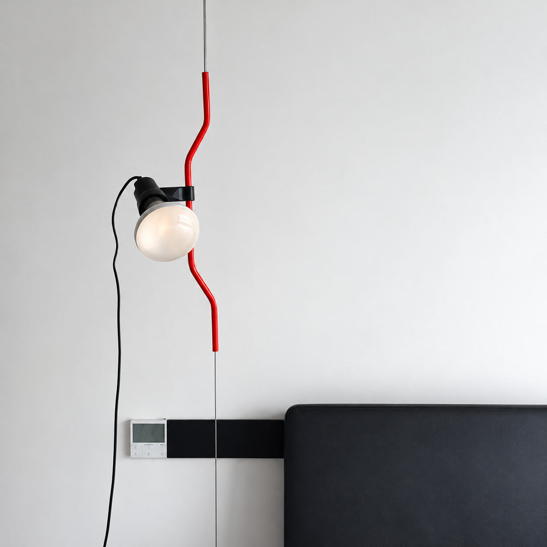 Close-up of the bent parenthesis-shaped rod and reflector spotlight on the Parentheses lamp