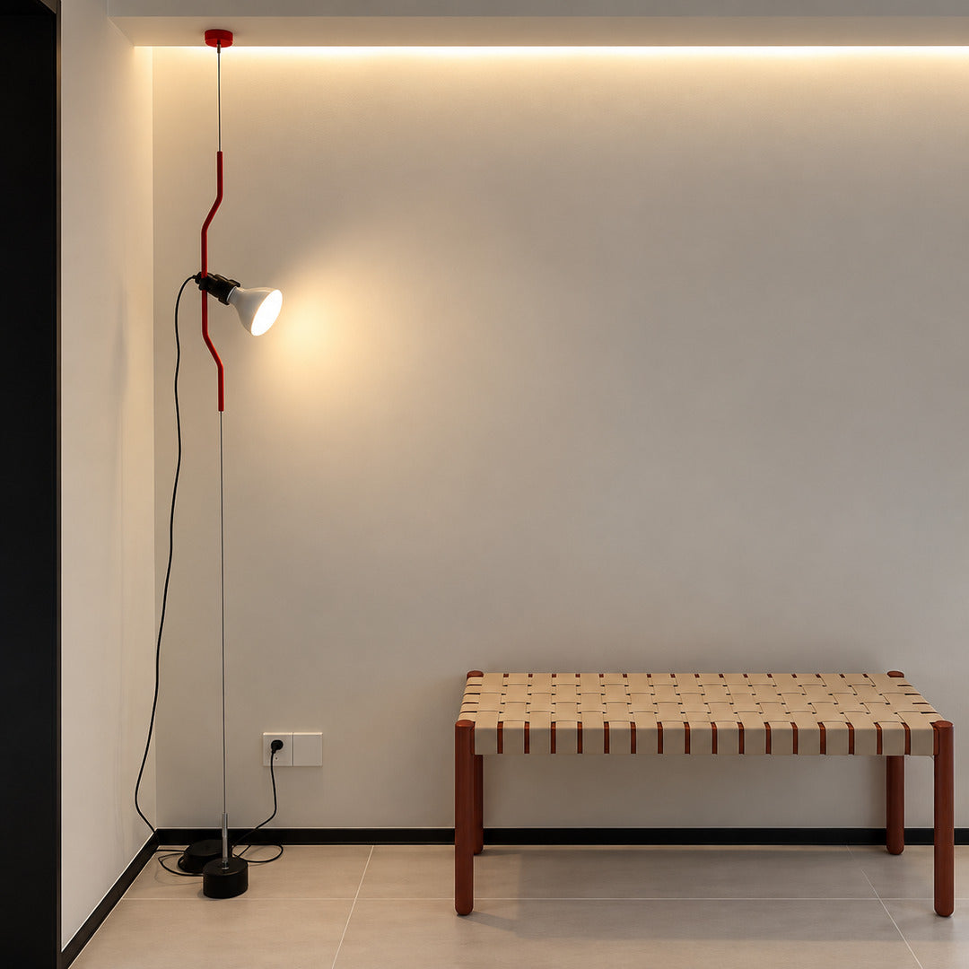 Parentheses spotlight lamps over reading chairs in a design bookstore