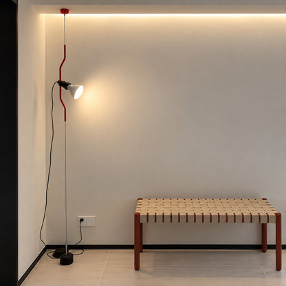 Parentheses spotlight lamps over reading chairs in a design bookstore
