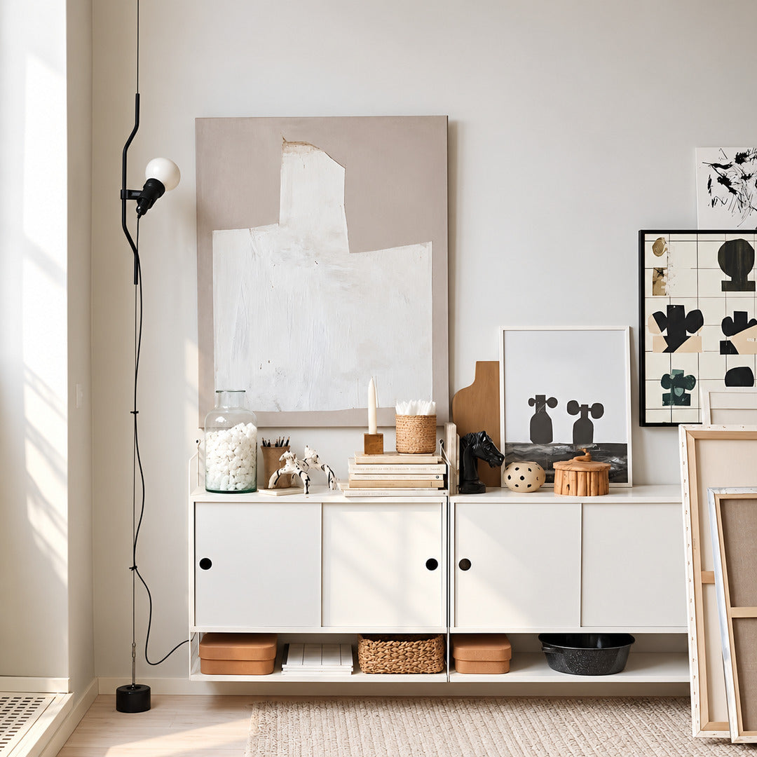 Parentheses floor-to-ceiling lamp turning an empty living room corner into a slim light feature