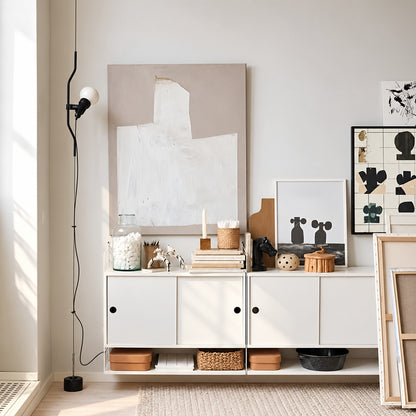 Parentheses floor-to-ceiling lamp turning an empty living room corner into a slim light feature