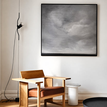 White Parentheses spotlight angled to light a large painting on a living room wall