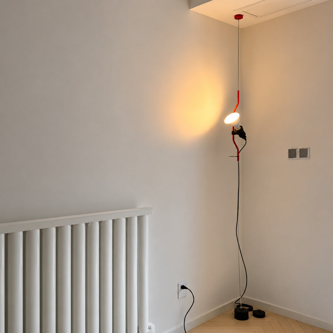 Parentheses floor-to-ceiling lamp turning an empty living room corner into a slim light feature