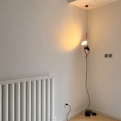 Parentheses floor-to-ceiling lamp turning an empty living room corner into a slim light feature