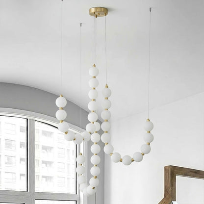 Pearla chandelier pearl finished beads brass frame strand detail close up
