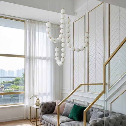 Pearla chandelier pearl finished beads brass frame strand detail close up