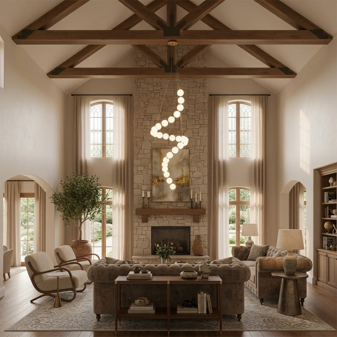 Pearla beaded chandelier hanging in two-story foyer cascading pearl strands elegant entryway