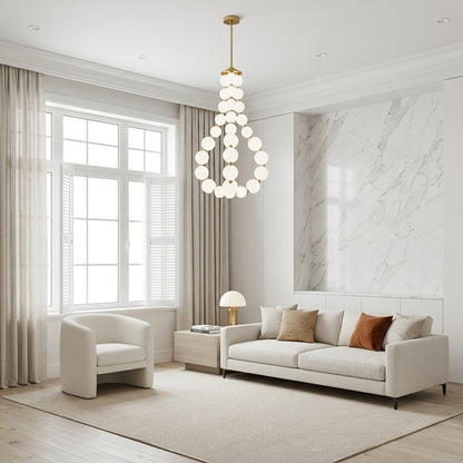 Pearla beaded chandelier hanging in two-story foyer cascading pearl strands elegant entryway