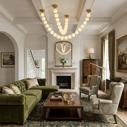 Pearla Grand multi-tier pearl chandelier in two story foyer grand entryway warm glow luxury home