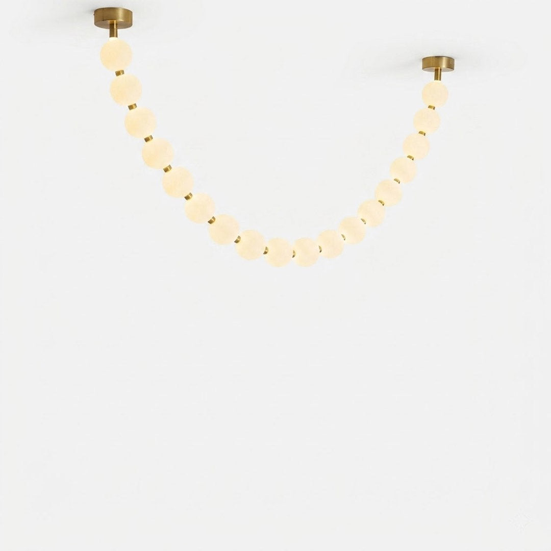Pearla Grand multi-strand pearl chandelier 23 ball combination brass white background