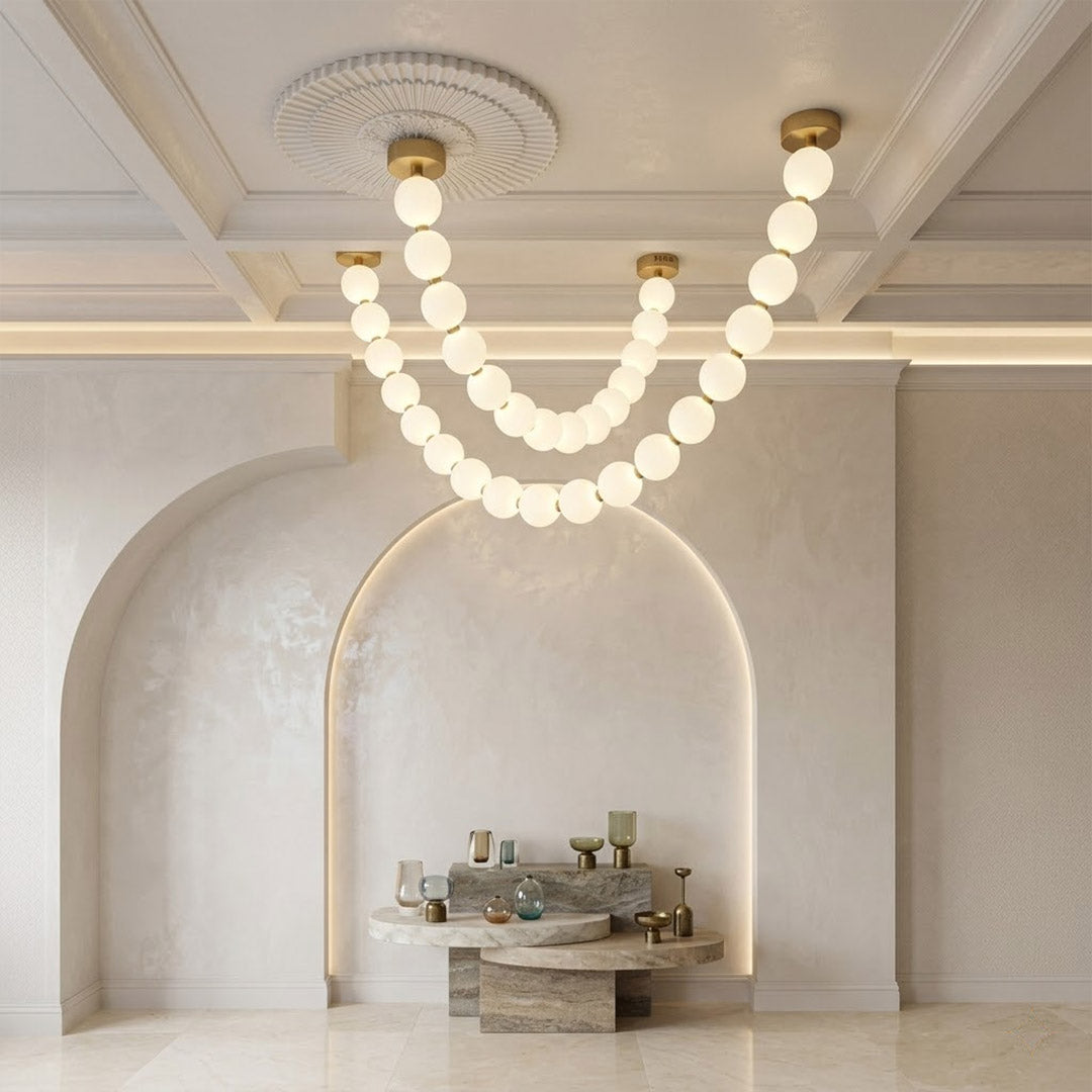 Pearla Grand multi-tier pearl chandelier in two story foyer grand entryway warm glow luxury home