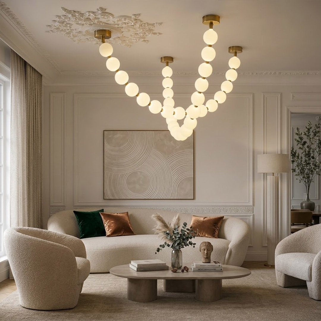 Pearla Grand multi-tier pearl chandelier in two story foyer grand entryway warm glow luxury home