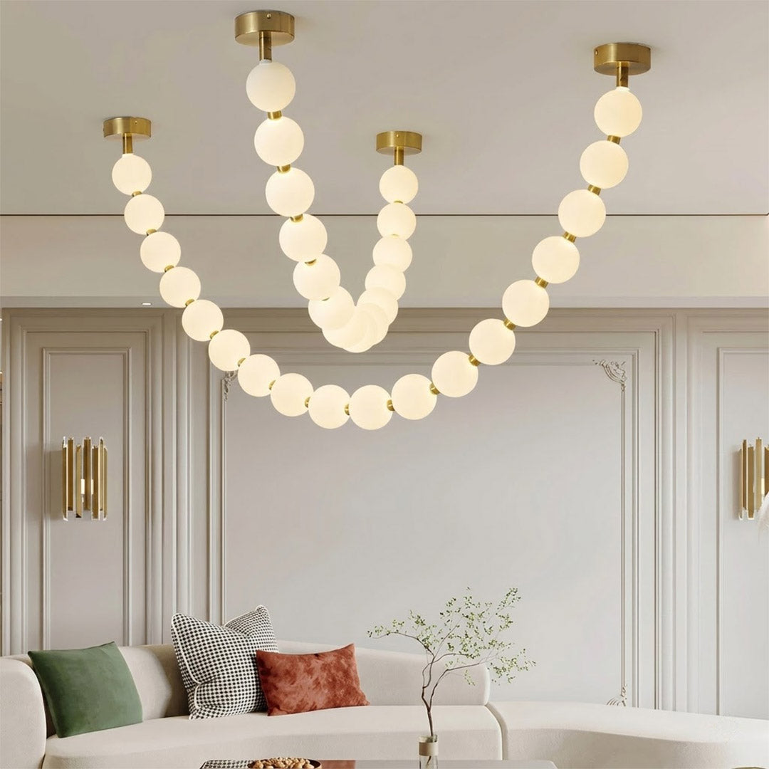 Pearla Grand multi-tier pearl chandelier in two story foyer grand entryway warm glow luxury home