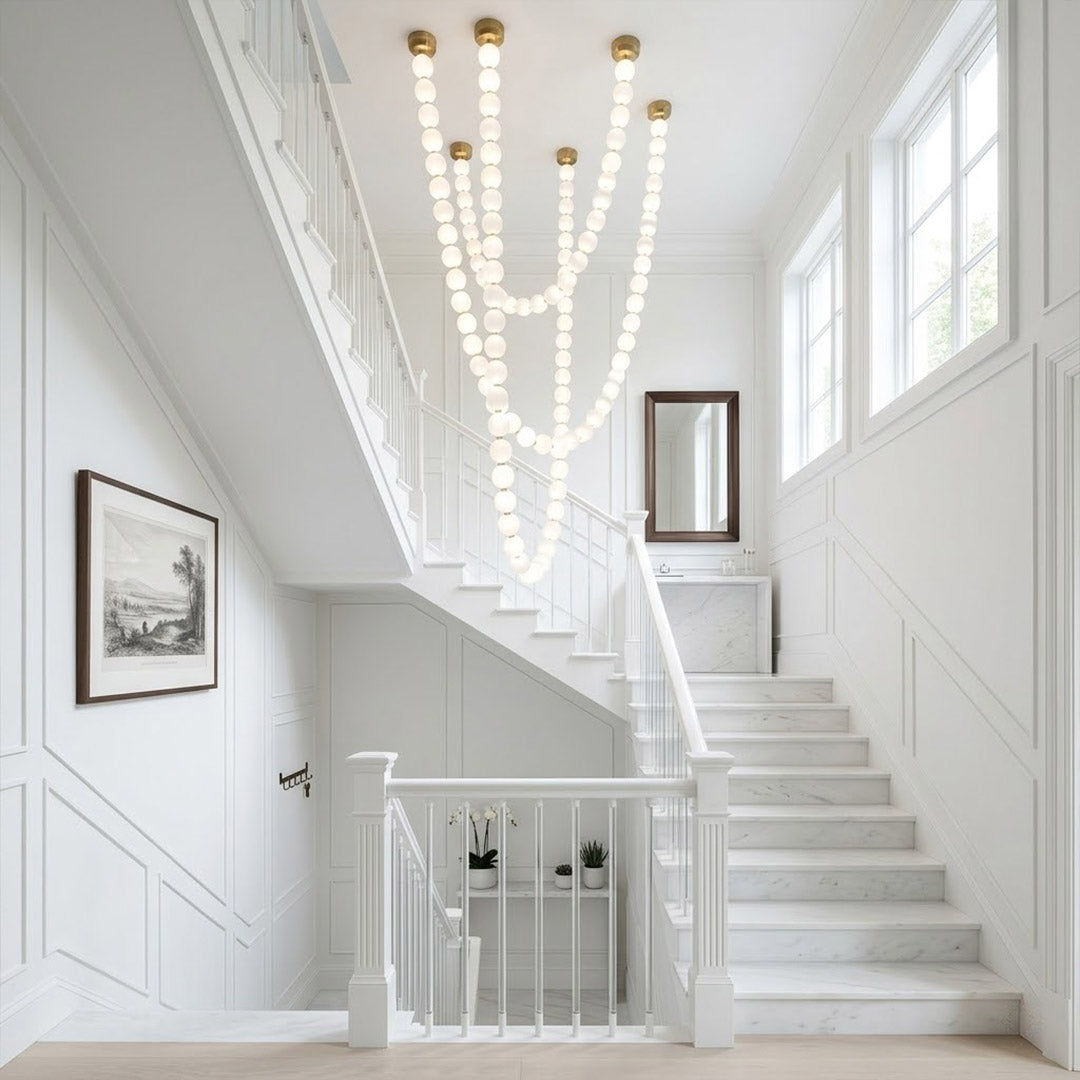 Pearla Grand 14 18 32 ball pearl chandelier in vaulted ceiling atrium space cascading pearl strands