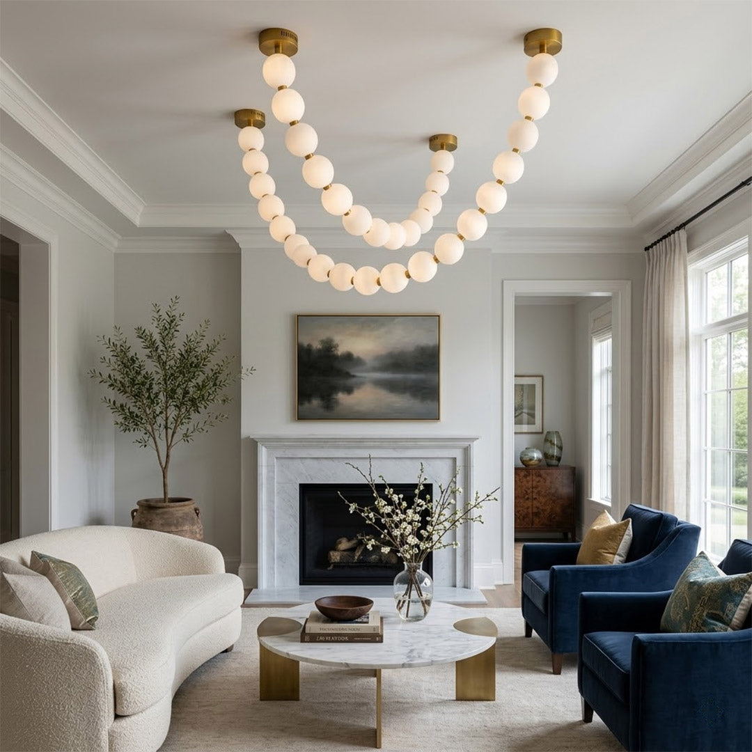 Pearla Grand multi-tier pearl chandelier in two story foyer grand entryway warm glow luxury home