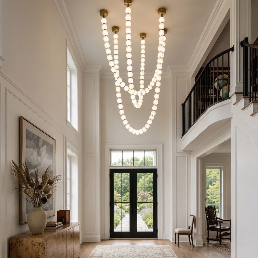 Pearla Grand 14 18 32 ball pearl chandelier in vaulted ceiling atrium space cascading pearl strands
