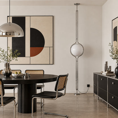 Pendolo tension pole lamp lighting a rental apartment bedroom without drilling or wiring