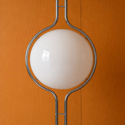 Close-up of the opal acrylic globe cradled in the silver chrome ring of the Pendolo lamp