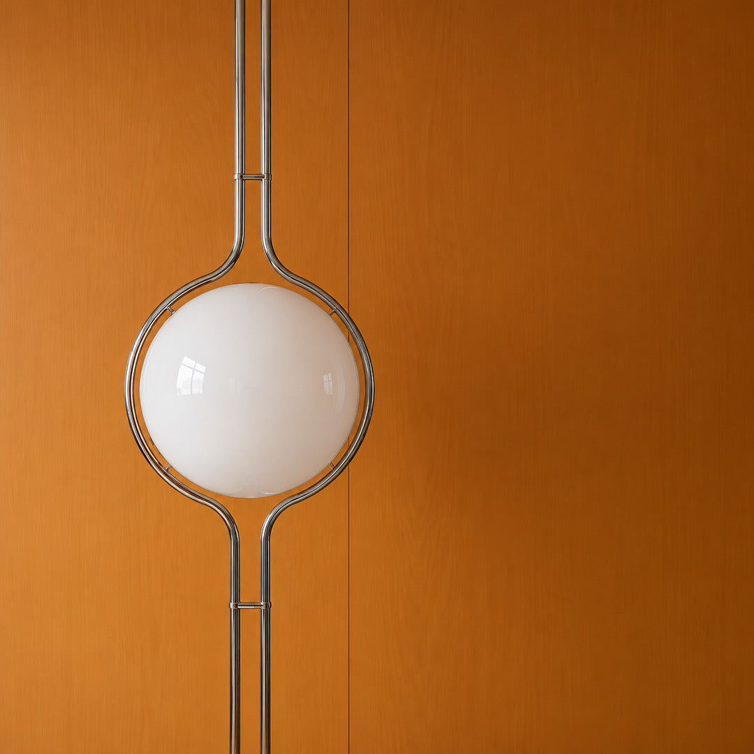 Close-up of the opal acrylic globe cradled in the silver chrome ring of the Pendolo lamp