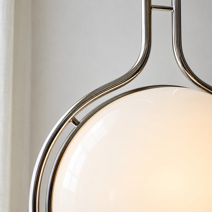 Close-up of the opal acrylic globe cradled in the silver chrome ring of the Pendolo lamp