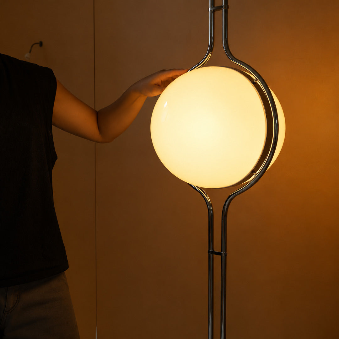 Pendolo opal globe glowing soft and glare-free inside its silver chrome frame