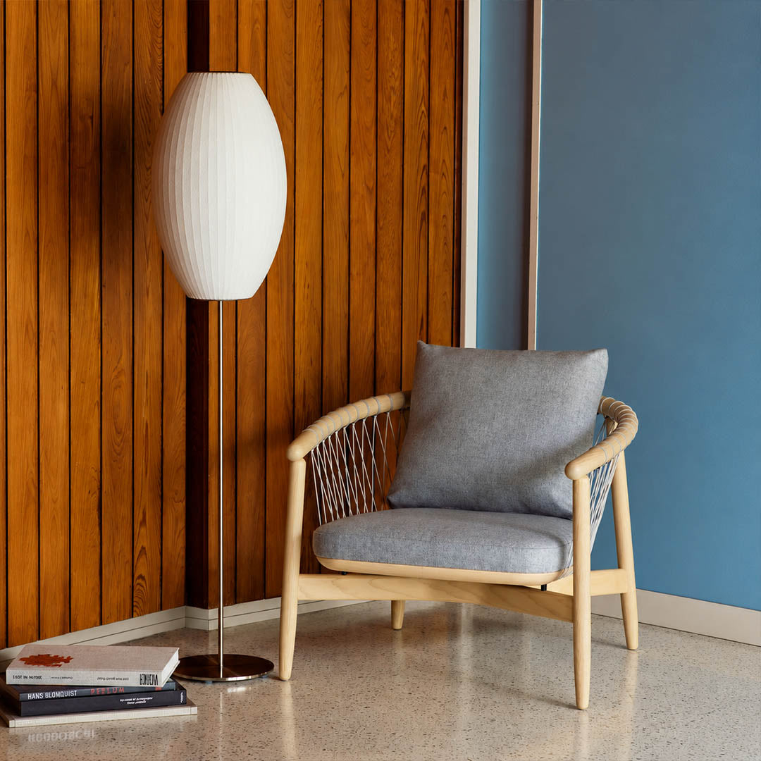 Perla Model B small pear silk bubble floor lamp reading nook corner armchair book warm ambient cozy mid century modern lifestyle interior