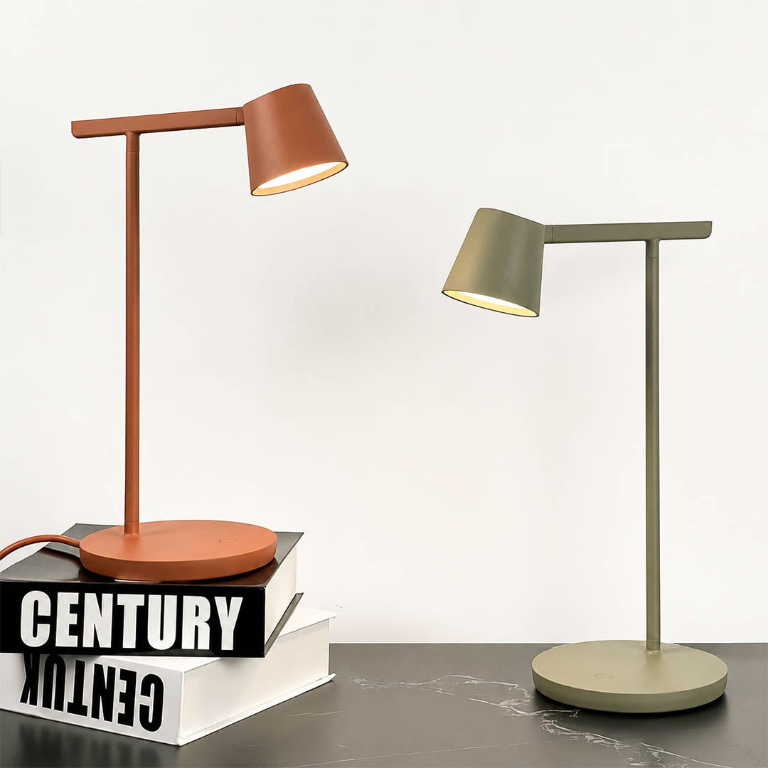 Perno table lamp illuminated warm ambient glow through acrylic opal diffuser evening cozy focused reading working Nordic minimalist detail close up mood