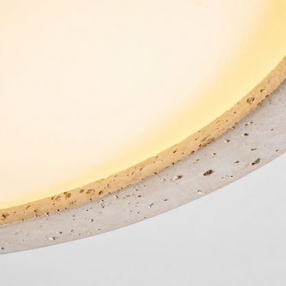 Piana travertine ceiling light yellow travertine natural stone veining porous texture disc detail close up unique