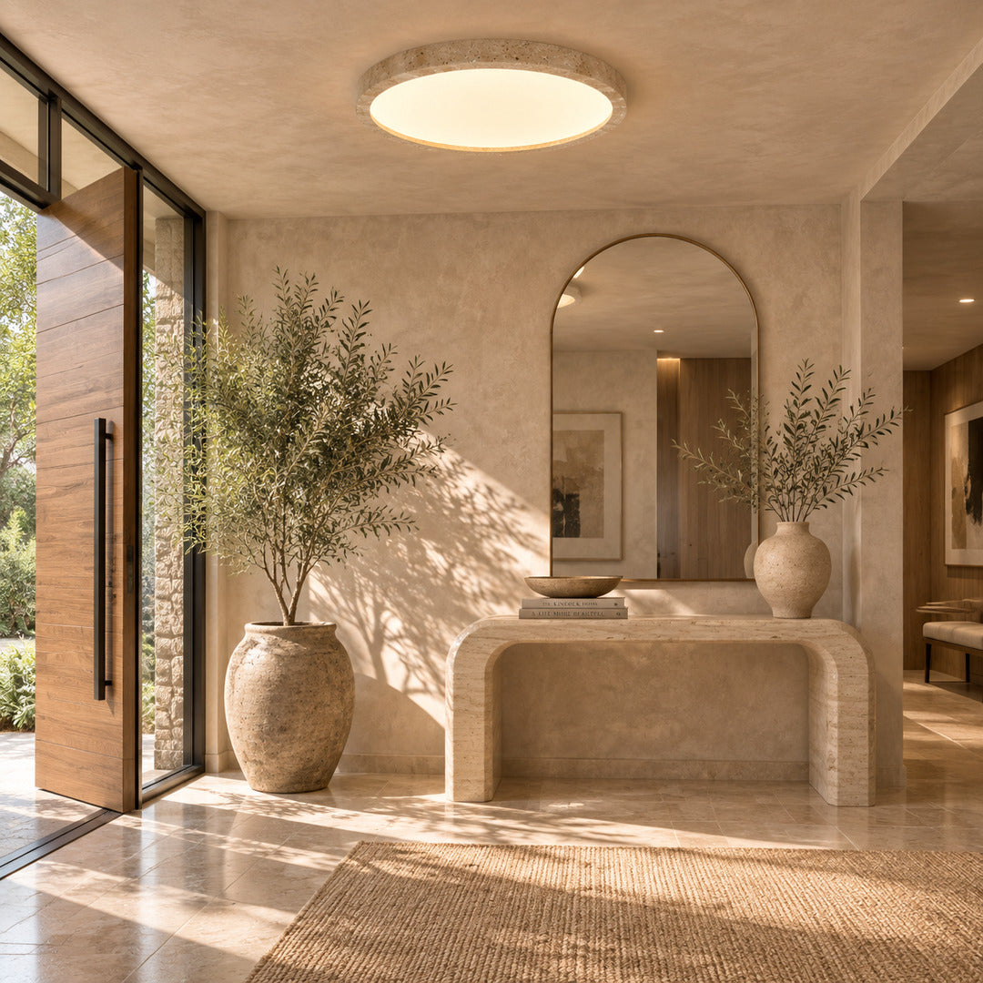 Piana travertine ceiling light entryway foyer warm glow travertine stone disc flush mount American home lifestyle interior styled