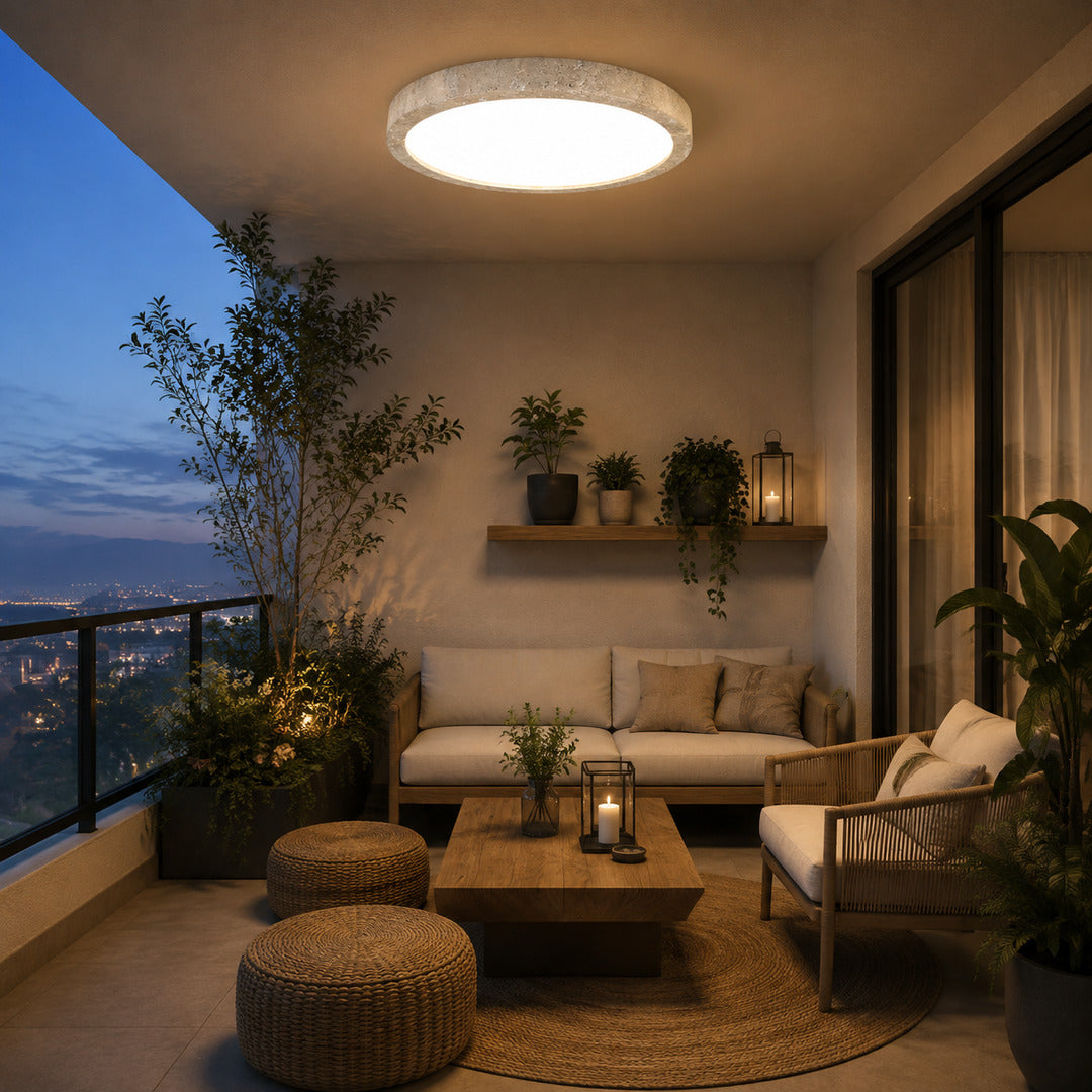 Piana travertine ceiling light illuminated evening warm glowing travertine stone disc cozy American home lifestyle interior