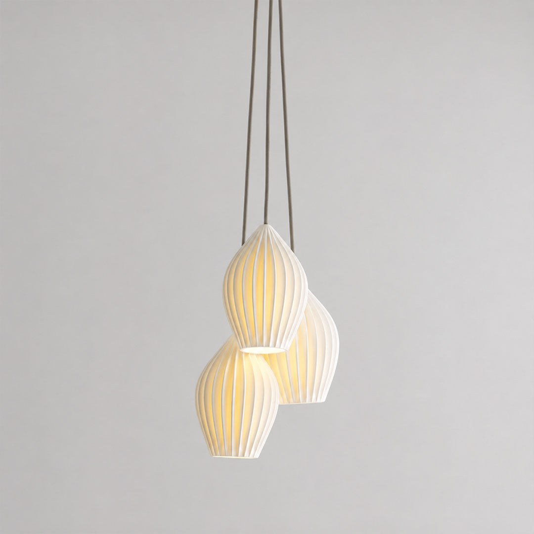 Piega pendant light 3 light cluster chandelier bone china ceramic ribbed pleated boho modern dining room entryway hardwired white background