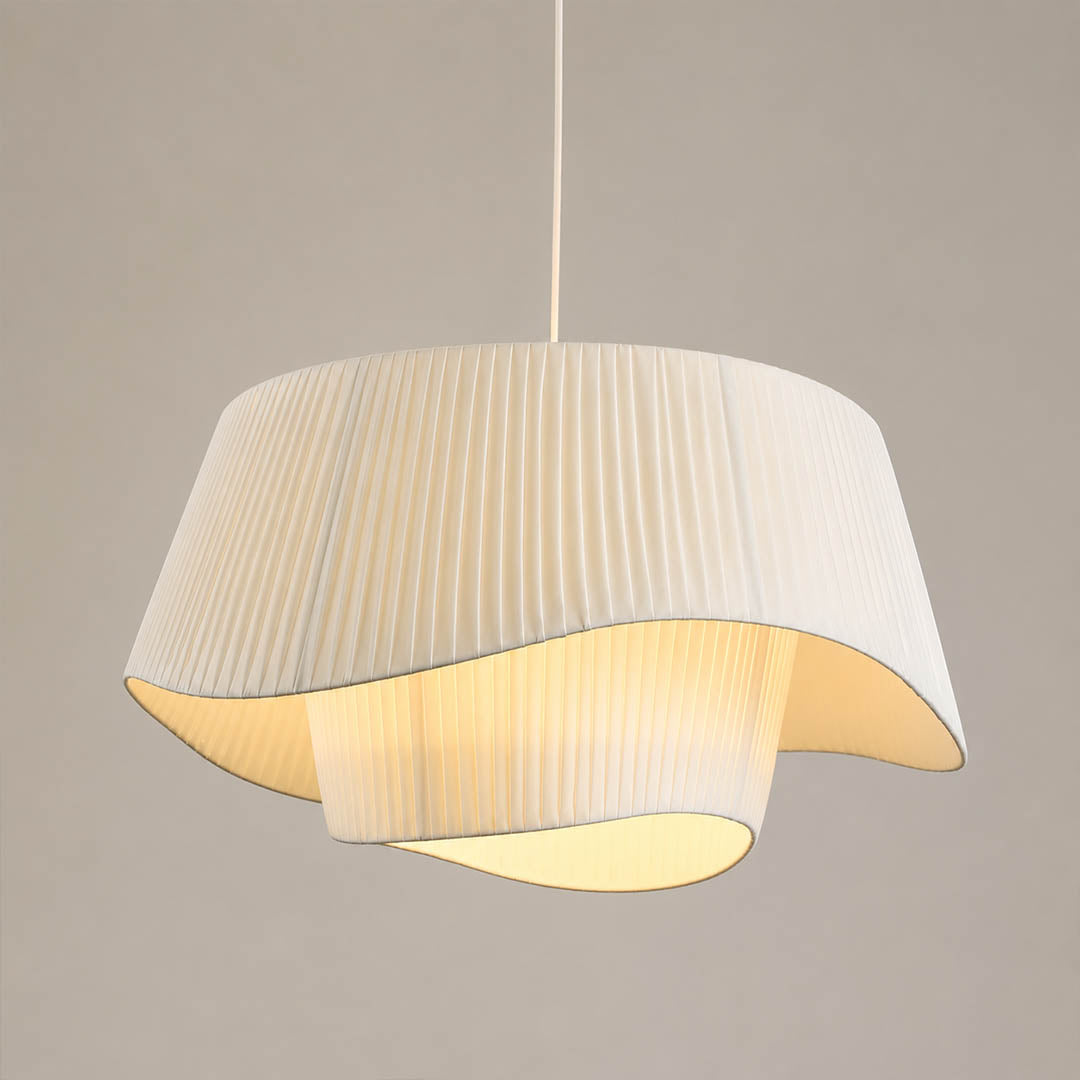 Plisse pleated pendant light beige fabric drum shade hand pleated sculptural modern white background front view